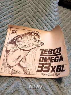 Moulinet de pêche Zebco Omega 33 XBL à lancer vintage dans sa boîte d'origine avec papiers, comme neuf, 76